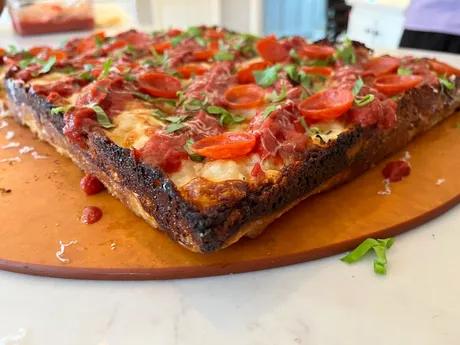 Detroit-style pepperoni, edge shot, baked by Bill