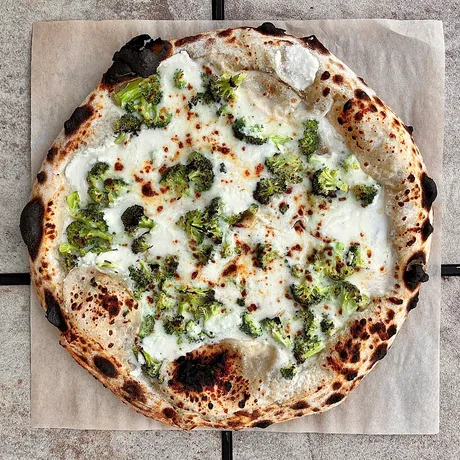 Broccoli ricotta white pizza in the Blackstone, baked by Bill