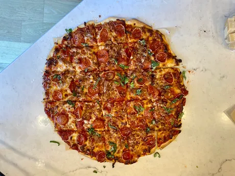 Thin crust tavern-style, square cut, baked by Bill